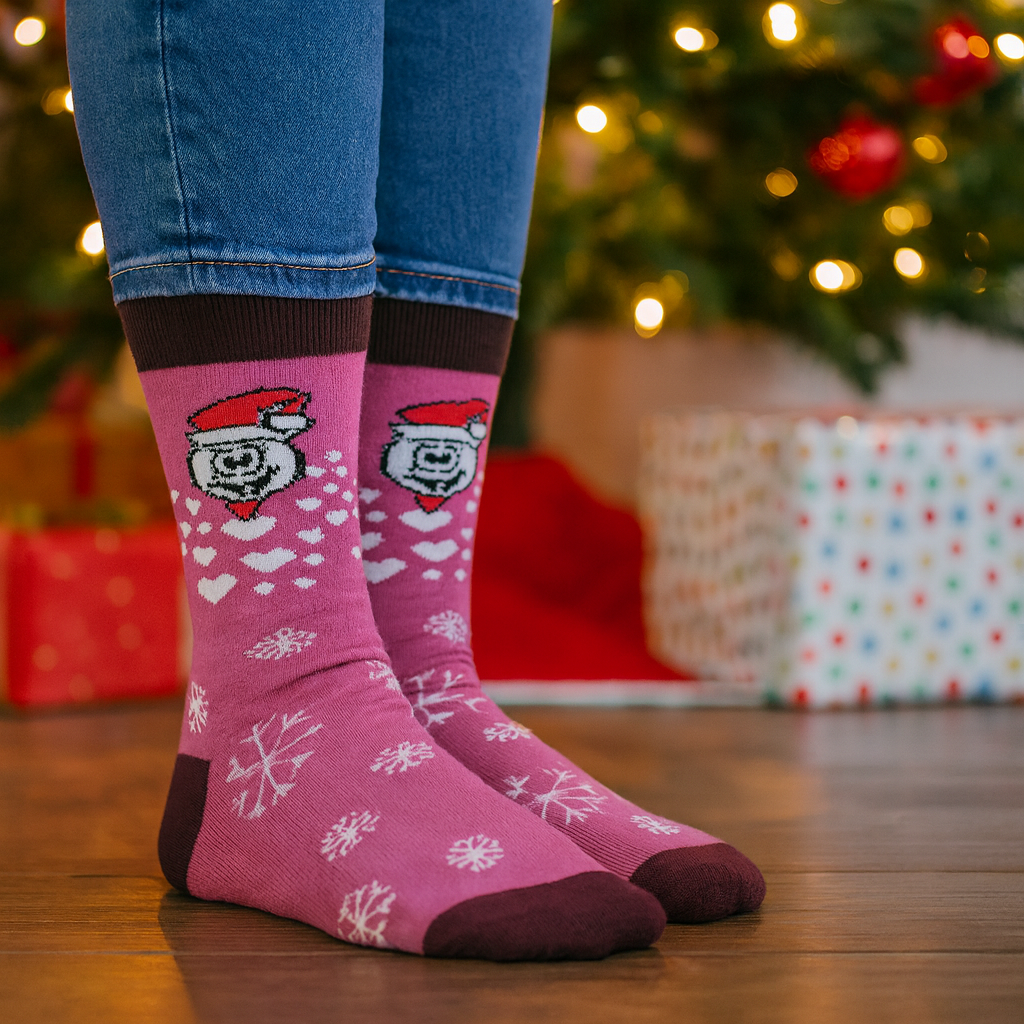 Flat lay of assorted  Christmas socks featuring Santa, snowmen, and candy cane patterns
