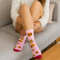 Women wearing Valentine’s Day fancy crew socks at home