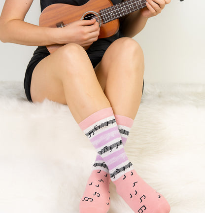 Women wearing music design novelty crew socks at home