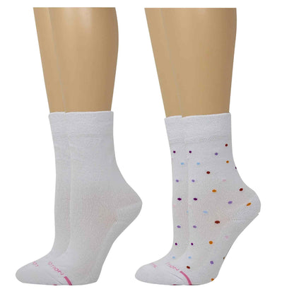 White socks with colorful polka dots on a mannequin foot against a white background