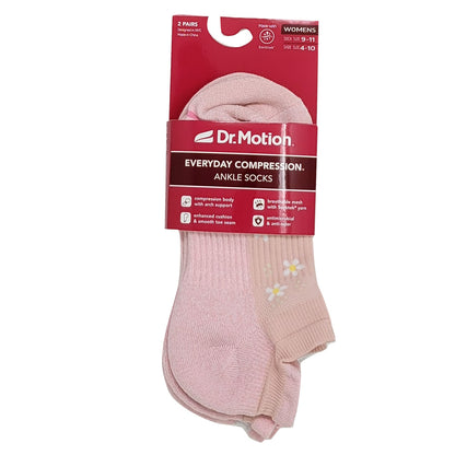 Pink ankle socks with a Dr. Motion packaging on a white background