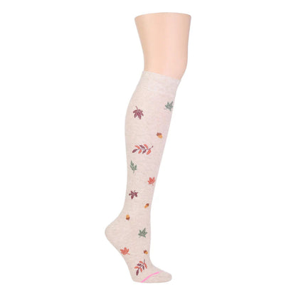 Knee high compression socks with fall foliage pattern on a female mannequin leg.