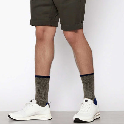 compression socks supporting men's feet during active movement