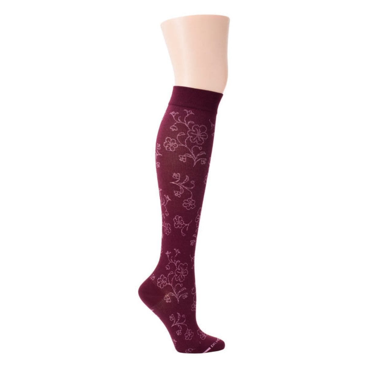 Maroon knee-high sock with floral pattern on a mannequin leg against a white background