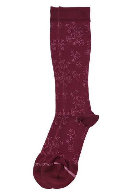 Maroon knee-high sock with floral pattern on a white background
